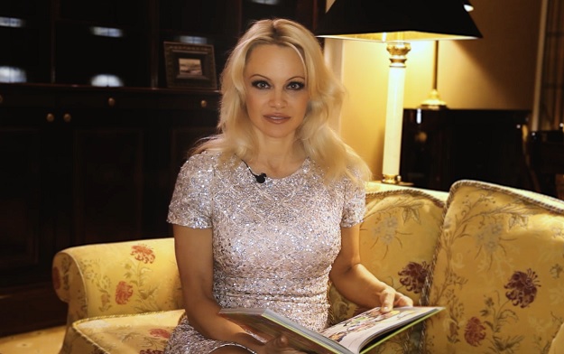 Pamela Anderson reads to Russian orphans and helps find them homes